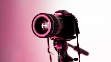 Image of a DSLR camera posed to take a stock photo