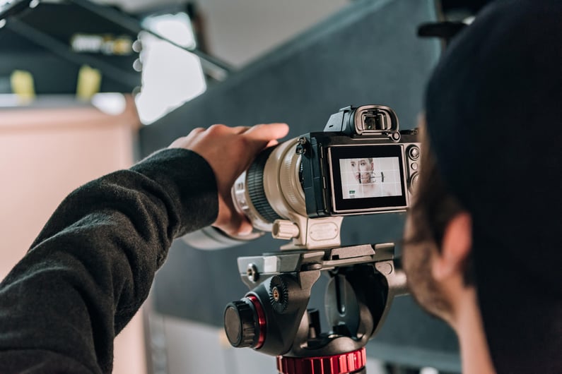 selective-focus-of-videographer-filming-woman-