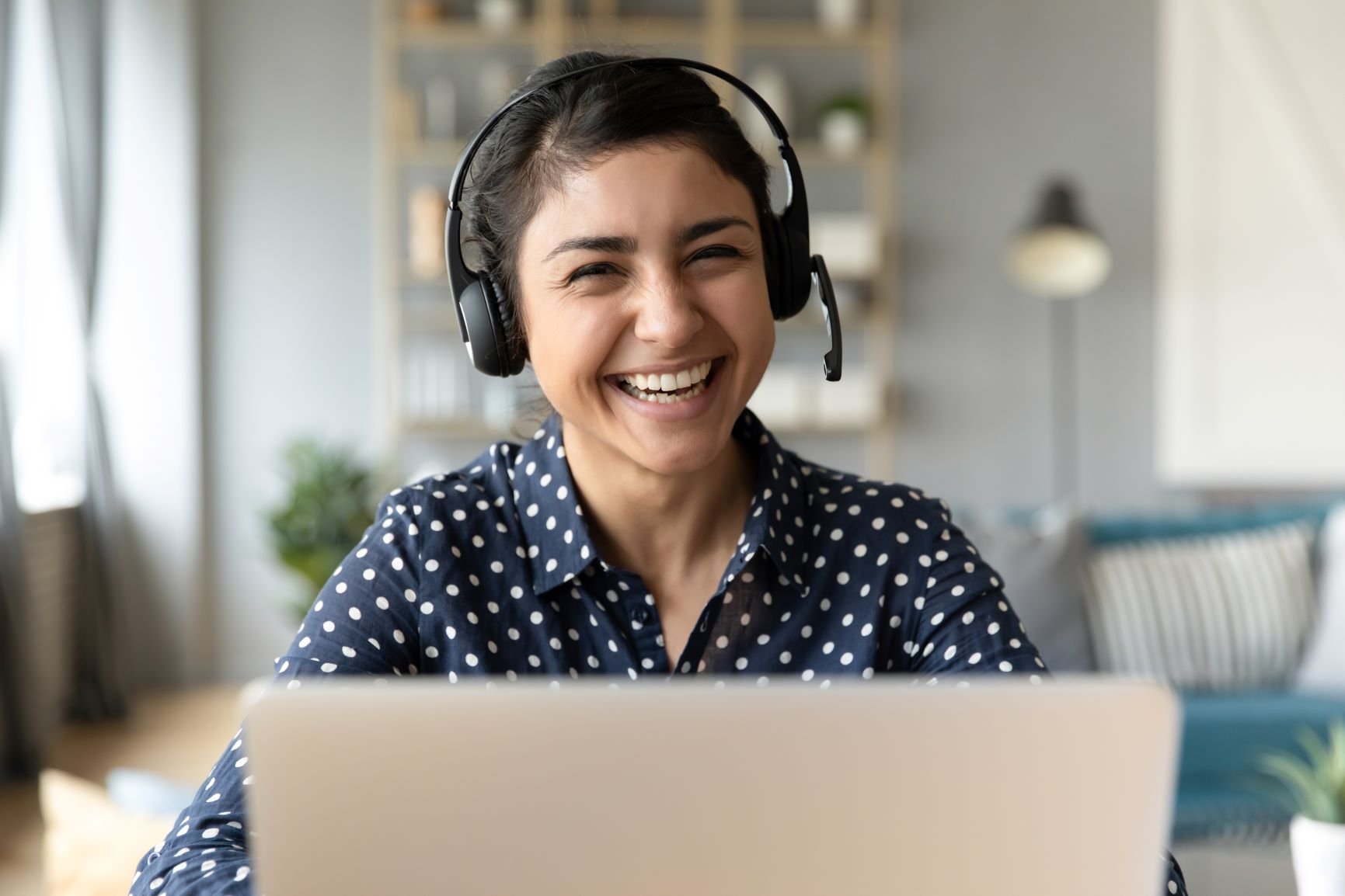 friendly woman with headset smiling at the camera