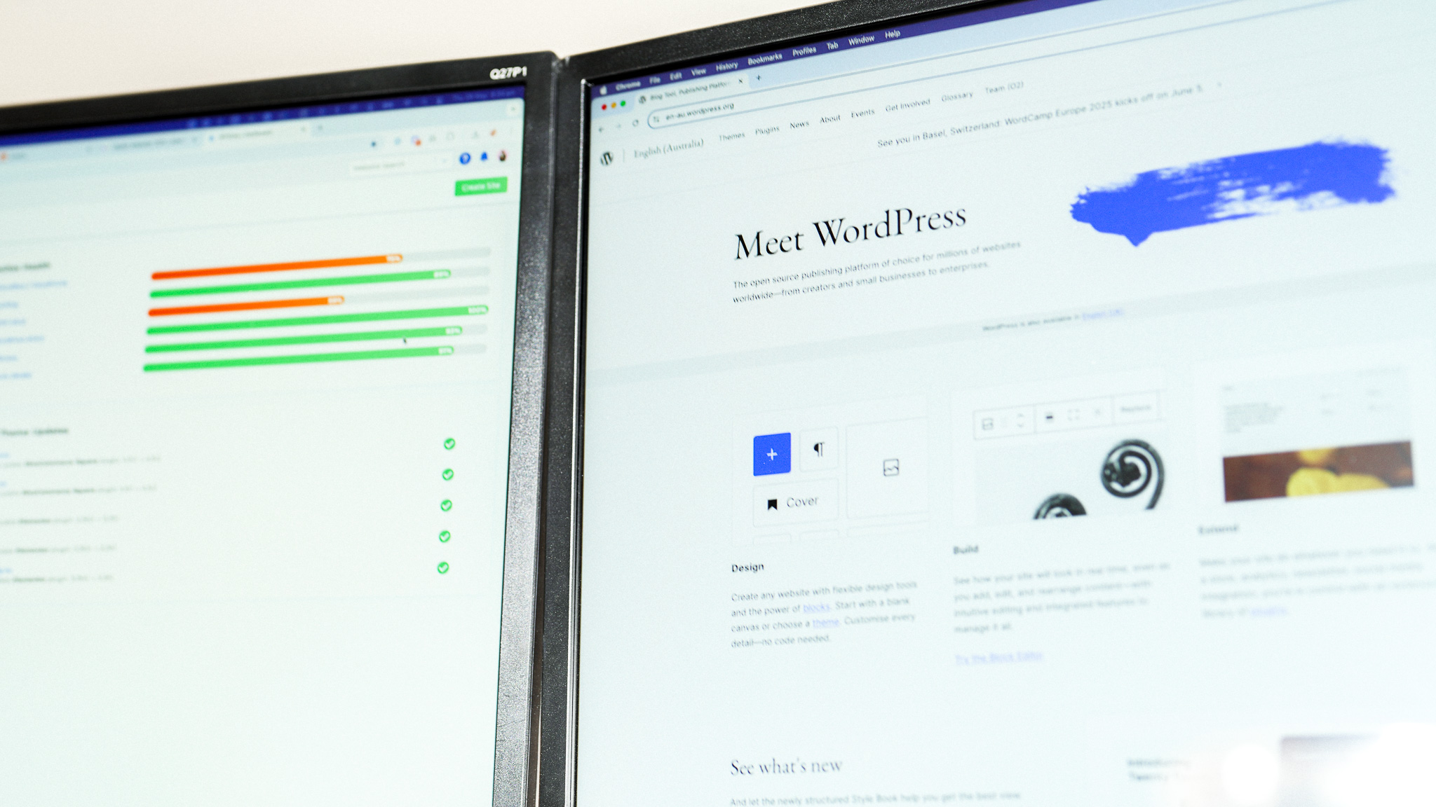 Two monitors, one showing Wordpress website open