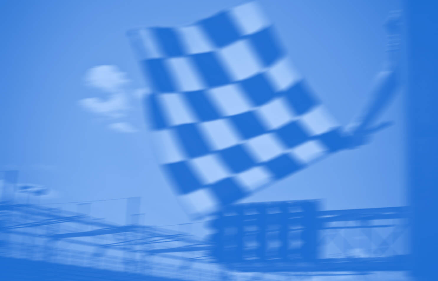 Checkered flag being waved at car race