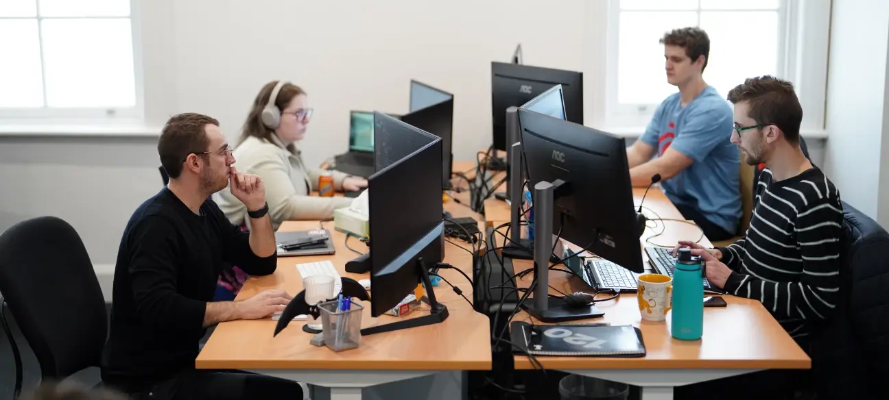 office-workers-sitting-at-their-desks-looking-at-computers